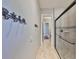 This hallway features coastal themed decor and a shower at 912 Symphony Beach Ln, Apollo Beach, FL 33572