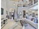 Expansive living area featuring elegant furnishings, high ceilings, and abundant natural light at 912 Symphony Beach Ln, Apollo Beach, FL 33572