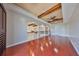 Spacious loft area featuring wood beam ceiling detail and arched openings to the lower level at 912 Symphony Beach Ln, Apollo Beach, FL 33572