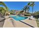 Community pool with many palm trees and lounge chairs at 912 Symphony Beach Ln, Apollo Beach, FL 33572