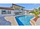 Beautiful home with a pool, bar-b-q, and hot tub that enhances an inviting outdoor space at 912 Symphony Beach Ln, Apollo Beach, FL 33572