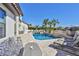 An inviting outdoor space with a pool, lounge chairs, and lush tropical landscaping at 912 Symphony Beach Ln, Apollo Beach, FL 33572