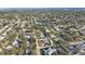 Aerial view of a neighborhood showing the property's location near a lake at 9169 Robin Rd, Seminole, FL 33777