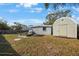 Backyard featuring a shed, sandbox with canopy, and outdoor seating area at 9169 Robin Rd, Seminole, FL 33777