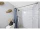 Updated bathroom features a tiled walk-in shower with a shower caddy at 9169 Robin Rd, Seminole, FL 33777