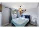 Cozy bedroom featuring a comfortable bed, stylish lighting, and decorative wall accents for a relaxing ambiance at 9169 Robin Rd, Seminole, FL 33777