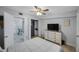 Bedroom featuring a ceiling fan and a view of the kitchen and dining area at 9169 Robin Rd, Seminole, FL 33777