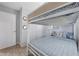 Comfortable bedroom featuring bunk beds, ample storage, and modern design elements for a cozy retreat at 9169 Robin Rd, Seminole, FL 33777