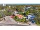 Charming home with a white picket fence surrounded by mature landscaping and mature trees at 1011 W Columbus Dr, Tampa, FL 33602