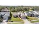 Aerial view of a single-story house in a quiet neighborhood with well-kept lawns at 11018 Courtland St, Trinity, FL 34655