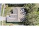 Birds eye view of a roof of home with lush green yard and mature trees at 11018 Courtland St, Trinity, FL 34655