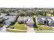 Aerial view of a well-maintained single-story home with lush lawns and landscaping at 11018 Courtland St, Trinity, FL 34655