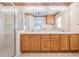 Bathroom featuring double sinks, vanity, and a glass enclosed shower at 11018 Courtland St, Trinity, FL 34655