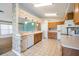 Functional kitchen with tile flooring, oak cabinets, and white appliances at 11018 Courtland St, Trinity, FL 34655