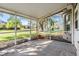 Screened-in lanai with a tile floor and views of the lush backyard and trees at 11018 Courtland St, Trinity, FL 34655