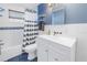 Bright bathroom with a shower-tub combo, a white vanity with storage, and modern fixtures at 12359 82Nd Avenue, Seminole, FL 33772