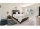 Cozy bedroom with a queen-size bed, soft carpet, and ample natural light from the window at 1274 Ocean Spray Dr, Ruskin, FL 33570