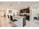 Modern kitchen featuring granite countertops, stainless steel appliances, a large island, and dark wood cabinets at 1274 Ocean Spray Dr, Ruskin, FL 33570