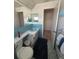 Full bathroom featuring a single sink and blue tile accents at 14132 89Th Ave, Seminole, FL 33776