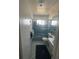 Full bathroom featuring a shower with sliding doors and a single sink at 14132 89Th Ave, Seminole, FL 33776