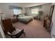 Bright bedroom with large windows, dresser, nightstands, and a comfortable bed at 14132 89Th Ave, Seminole, FL 33776