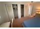 Bedroom with closet and carpeted floor. Includes bed, desk, and dresser with lamp at 14132 89Th Ave, Seminole, FL 33776