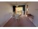 Dining room with table, chairs, and a large opening leading to the sunroom at 14132 89Th Ave, Seminole, FL 33776