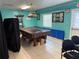 A vibrant game room featuring a classic pool table and ample seating at 14132 89Th Ave, Seminole, FL 33776