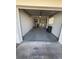 Spacious single-car garage featuring concrete flooring, shelves, washer and dryer and ample storage at 14132 89Th Ave, Seminole, FL 33776