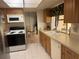 Well-maintained kitchen featuring a stainless steel refrigerator and plenty of counter space at 14132 89Th Ave, Seminole, FL 33776