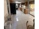 Bright kitchen featuring tiled flooring, wooden cabinets, and a sliding door to the outdoor patio at 14132 89Th Ave, Seminole, FL 33776