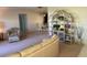 Open concept living room and dining area with a decorative shelving unit and comfortable seating at 14132 89Th Ave, Seminole, FL 33776