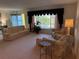 Spacious living room with a large window and comfortable seating, perfect for relaxing or entertaining at 14132 89Th Ave, Seminole, FL 33776
