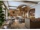 Elegant restaurant with wooden tables, stylish seating, and unique overhead lighting fixtures at 15000 Madeira Way # 543, Madeira Beach, FL 33708