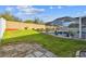 Spacious backyard with a screened-in pool area, perfect for outdoor entertaining and relaxation at 1721 Loriana St, Brandon, FL 33511