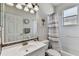 Well-lit bathroom with white vanity, framed mirror, and shower-tub combination at 1721 Loriana St, Brandon, FL 33511