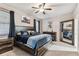 Spacious primary bedroom with a large bed, wood accents, and stylish decor at 1721 Loriana St, Brandon, FL 33511