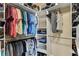 Spacious walk-in closet featuring ample shelving, hanging rods and organized storage at 1721 Loriana St, Brandon, FL 33511