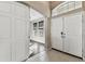 Inviting foyer with tile flooring, open doorway and view of living area with wood floors at 1721 Loriana St, Brandon, FL 33511