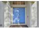 Close-up of a vibrant blue double front door with ornate hardware and sidelights at 1721 Loriana St, Brandon, FL 33511