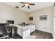 Bright office featuring dark wood floors, a ceiling fan and a modern white desk at 1721 Loriana St, Brandon, FL 33511