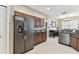 Well-equipped kitchen with stainless steel appliances, dark wood cabinetry, and granite countertops at 1721 Loriana St, Brandon, FL 33511