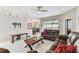 Bright living room featuring a wooden coffee table, comfortable seating, and an open floor plan at 1721 Loriana St, Brandon, FL 33511