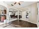 Spacious living room with hardwood floors, archways, backyard views, and open to the kitchen at 1721 Loriana St, Brandon, FL 33511