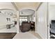 Open-concept living area with tile flooring, archways, and comfortable seating arrangement at 1721 Loriana St, Brandon, FL 33511
