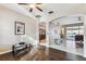 Open-concept living room with hardwood floors, archways, and views of kitchen and pool at 1721 Loriana St, Brandon, FL 33511