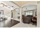 Bright living room featuring archways, tile and hardwood flooring, and backyard view at 1721 Loriana St, Brandon, FL 33511