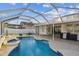 Inviting pool area with a spa and covered patio, ideal for outdoor entertaining and relaxation at 1721 Loriana St, Brandon, FL 33511