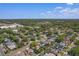 Panoramic aerial shot of the property in a neighborhood surrounded by trees, and community amenities at 1740 Shady Leaf Dr, Valrico, FL 33596