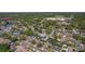 Wide aerial showcases the home nestled in a tree-filled neighborhood close to commercial areas and amenities at 1740 Shady Leaf Dr, Valrico, FL 33596
